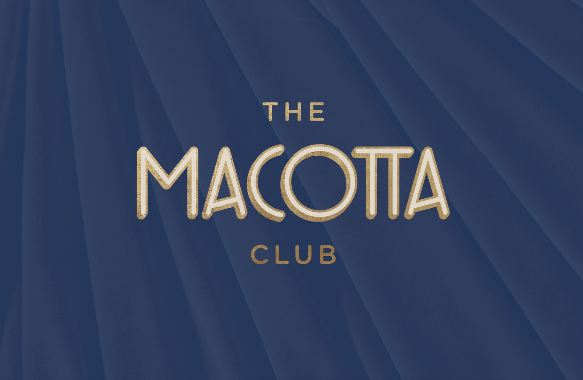 A gold-colored logo reads "The Macotta Club" in an Art Deco-inspired font, in front of a navy blue background.