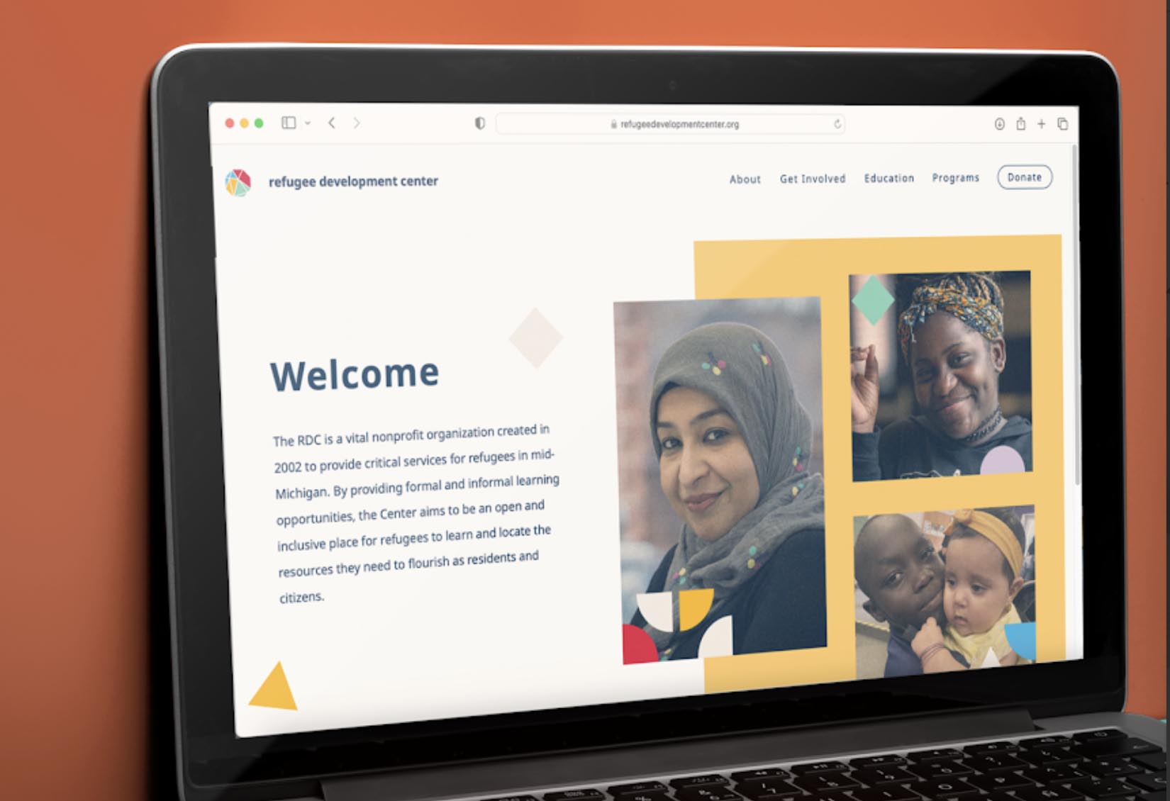 The homepage for the RDC website is displayed on a laptop. The screen includes a photo of a smiling woman and reads "Welcome."